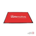 Feature floor mat showing automotive artwork